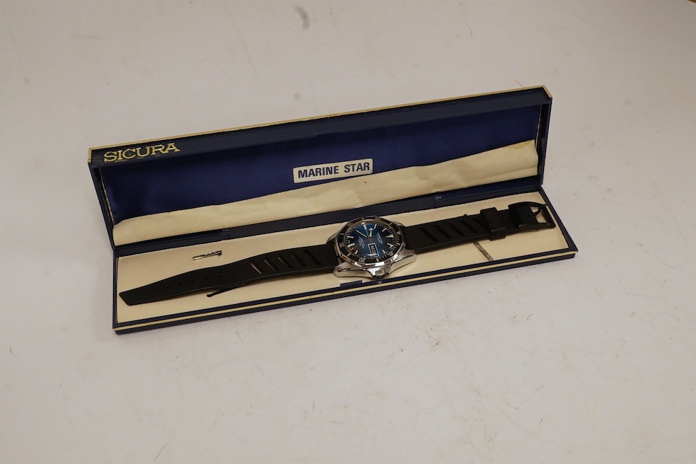 A gentleman's base metal Sicura Marine Star self-winding wrist watch, with baton numerals, two-tone dial and day/date aperture, case diameter 38mm, with box, no papers. Condition - fair to good